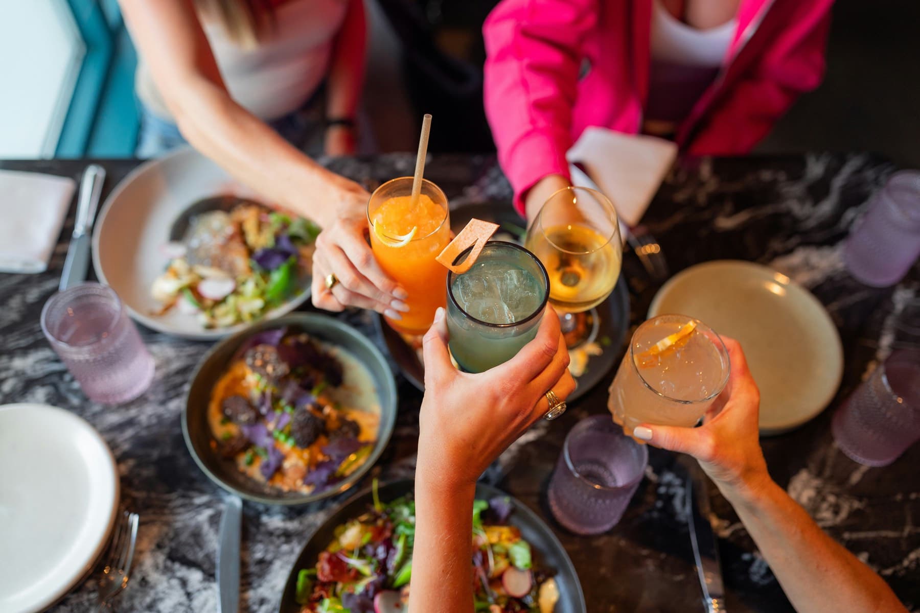 Friends sharing a meal at a restaurant table